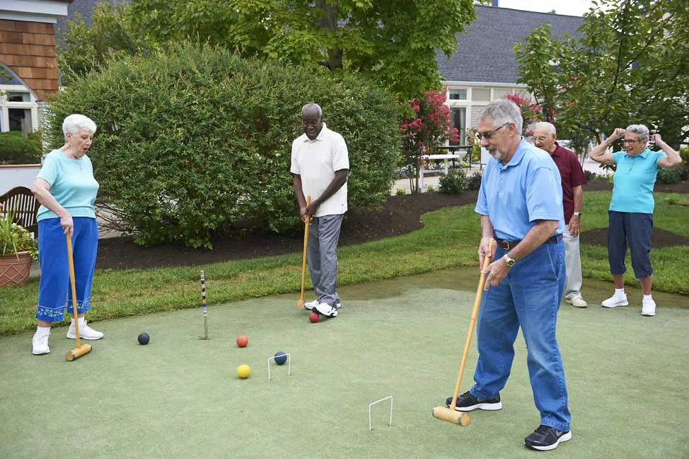 men and women playing cricket